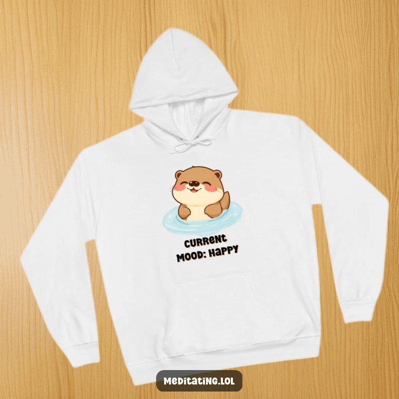 Funny Otter Hoodie: A cozy hoodie depicting a joyful otter serenely humming while floating, bringing warmth and smiles.