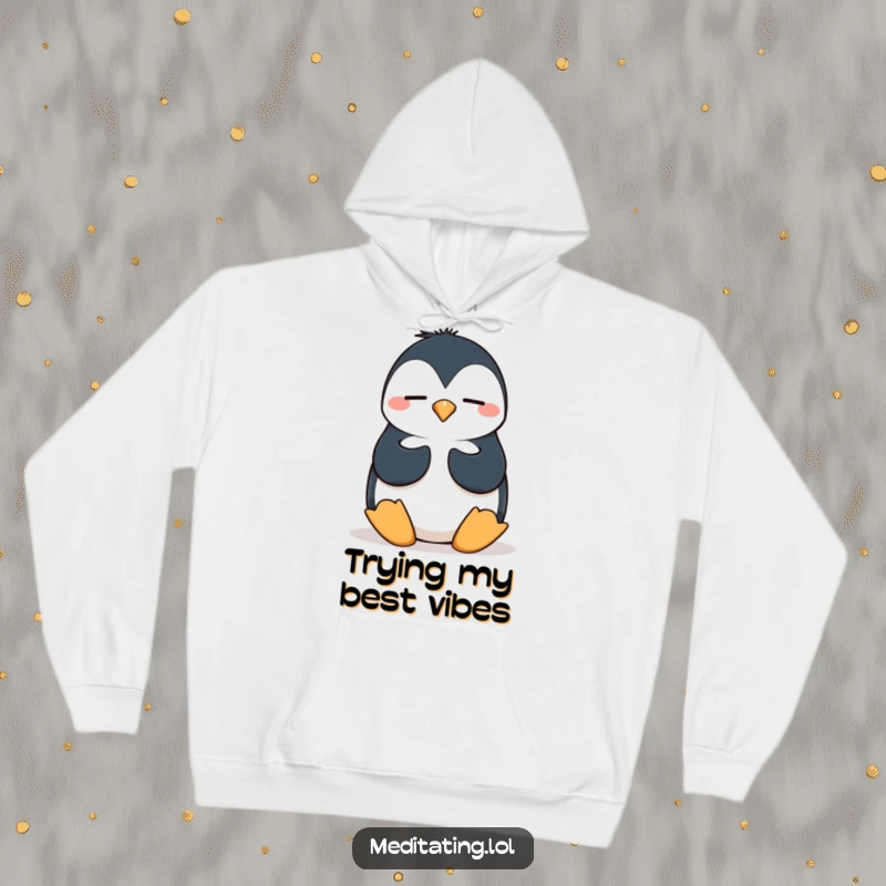 Funny penguin hoodie featuring a silly penguin attempting a wobbly meditation pose, providing warmth and humorous, whimsical comfort.