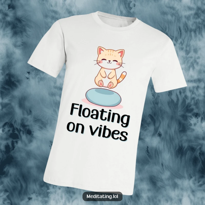 Funny T-Shirt: A cute cat levitating slightly above a meditation cushion, exuding humorous serenity and mystical balance.