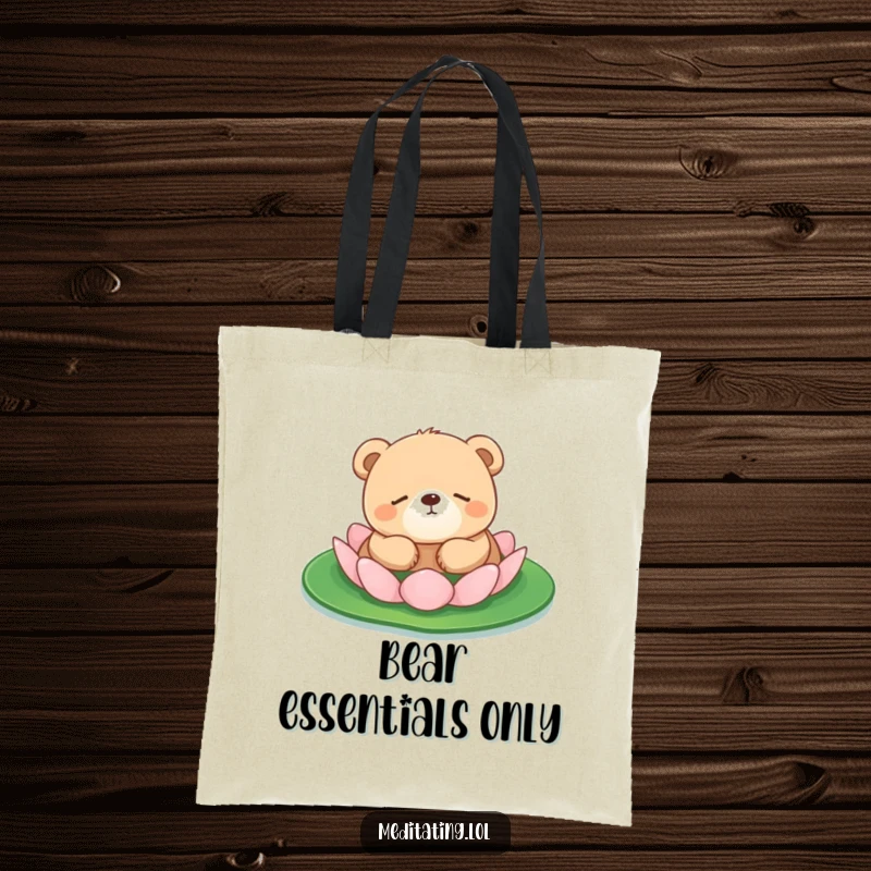 Funny bear cub tote bag depicting a small bear cub peacefully floating on a lily pad, perfect for carrying your calm.